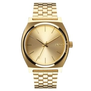 Nixon watch with gold bracelet and gold dial