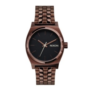 Nixon watch with bronze case and bracelet and black dial.