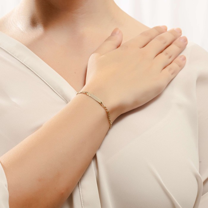 14K gold ID bracelet with engraved butterfly design