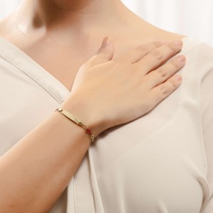 14K gold baby ID bracelet with pink enamel cross motif