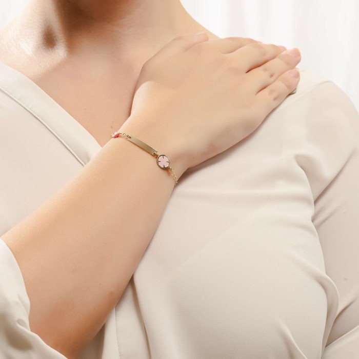 14K gold baby ID bracelet with circle motif and evil eye charm