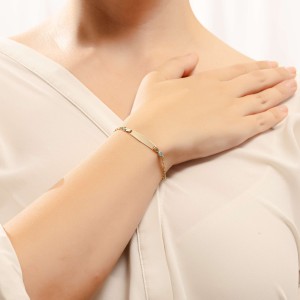 14K gold ID bracelet with blue stones