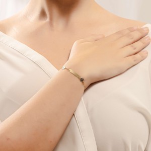 14K two-tone baby ID bracelet with clover motif and eye charm