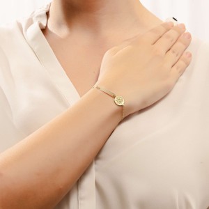 14K gold ID bracelet with Byzantine coin motif