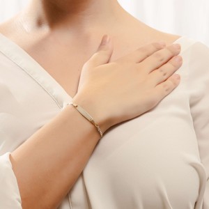 14K gold two-tone ID bracelet with engraving plate.