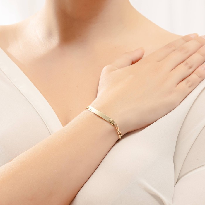 14K gold ID bracelet with white gold geometric motifs