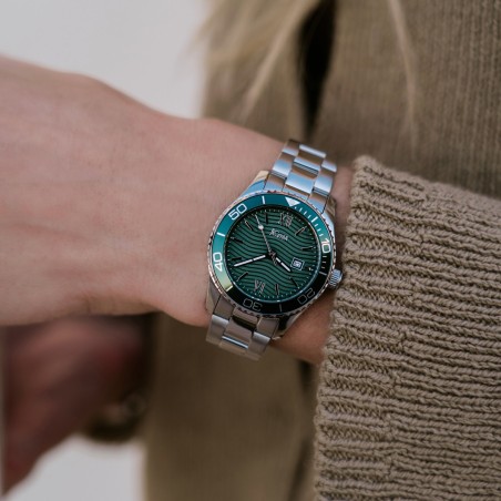 Stainless steel watch with green dial and matching bezel