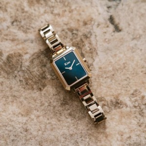 JCou watch with green dial and gold metal bracelet