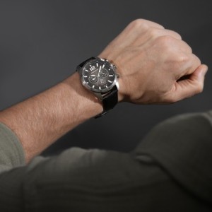 Police watch with black leather strap and dark dial