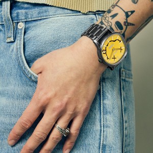 Nixon Nirvana watch with yellow dial and metal bracelet